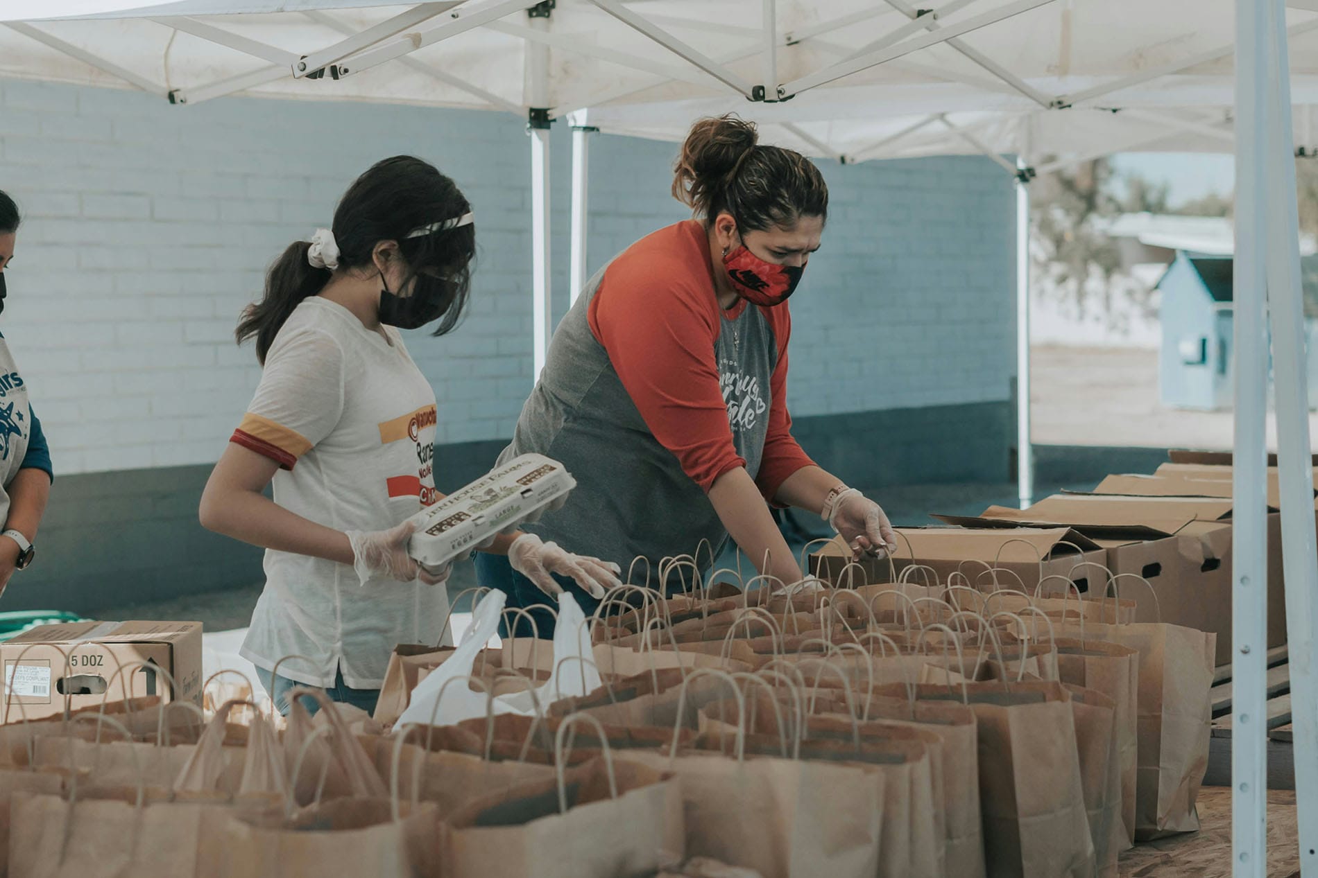 People handing out bags